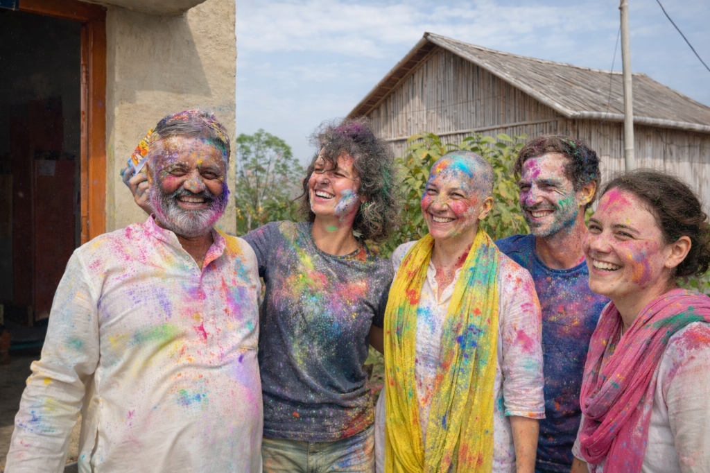 Group of people celebrating Holi with colorful faces
